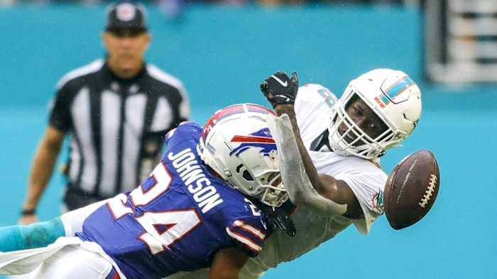 Buffalo Bills cornerback Taron Johnson (24) tackles Miami Dolphins wide receiver Preston Williams (18) during the third quarter of the game at Hard Rock Stadium.